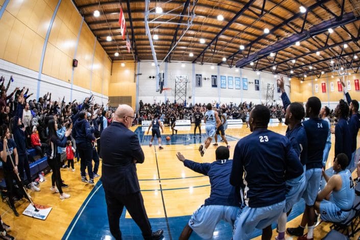 BRAMPTON, ON - FEB. 15, 2019: The stadium erupts during the 121st edition of 'The Game' between the Sheridan Bruins and the Humber Hawks.